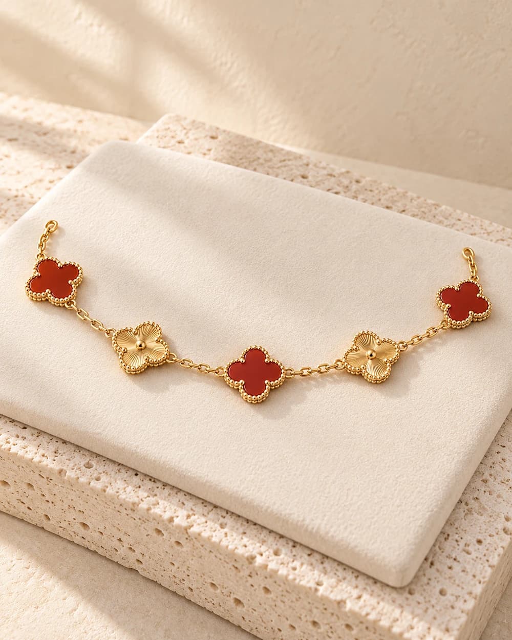 Van Cleef & Arpels Bracelet — Red and gold-tone motifs
